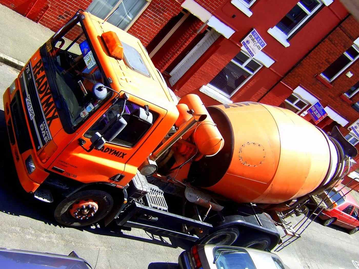 The orange drum of a mixer truck, close up